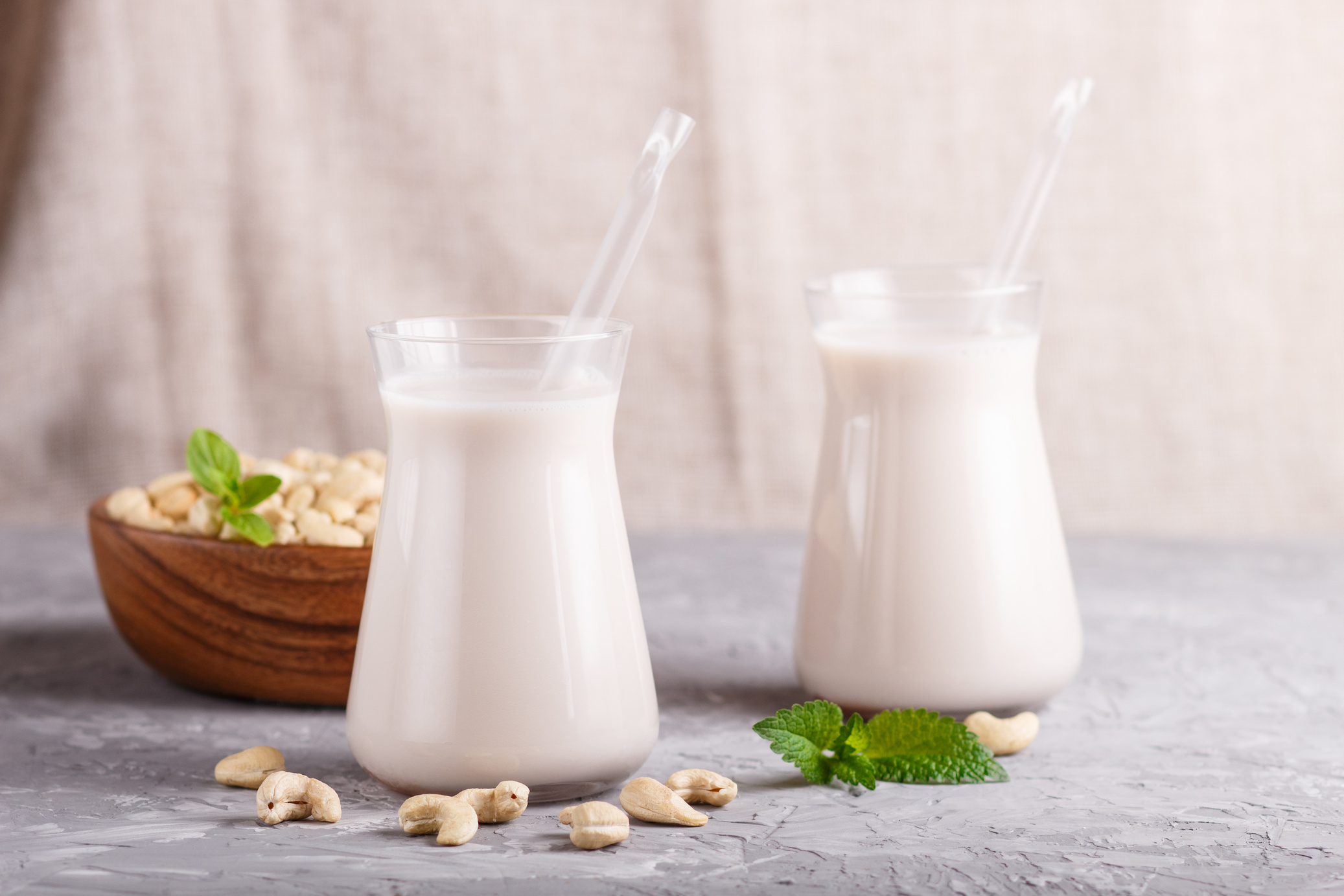 Glasses of Cashew Milk and Bowl of Nuts